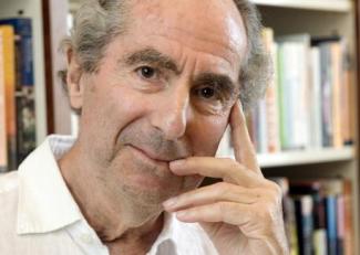 FILE - In this Sept. 8, 2008, file photo, author Philip Roth poses for a photo in the offices of his publisher, Houghton Mifflin, in New York. Roth, prize-winning novelist and fearless narrator of sex, religion and mortality, has died at age 85, his literary agent said Tuesday, May 22, 2018. (ANSA/AP Photo/Richard Drew, File) [CopyrightNotice: Copyright 2018 The Associated Press. All rights reserved.]